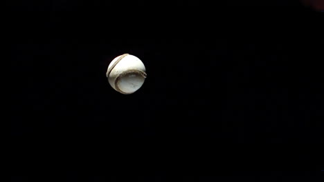 Hurling-ball-rotating-against-black-background