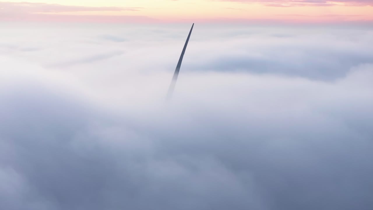 Drone shot of a Windturbine in foggy conditions