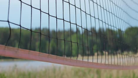 Red-De-Voleibol-En-Un-Primer-Plano-De-Fondo-De-Arena