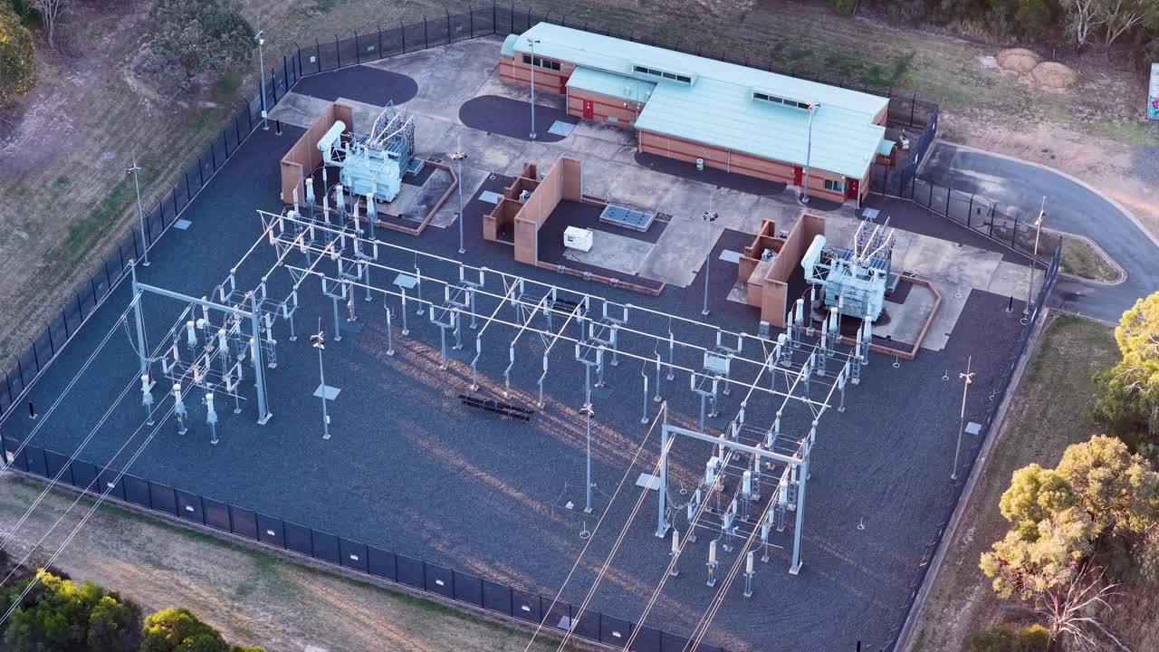 High angle drone shot of electrical infrastructure and transformers during golden hour in Canberra