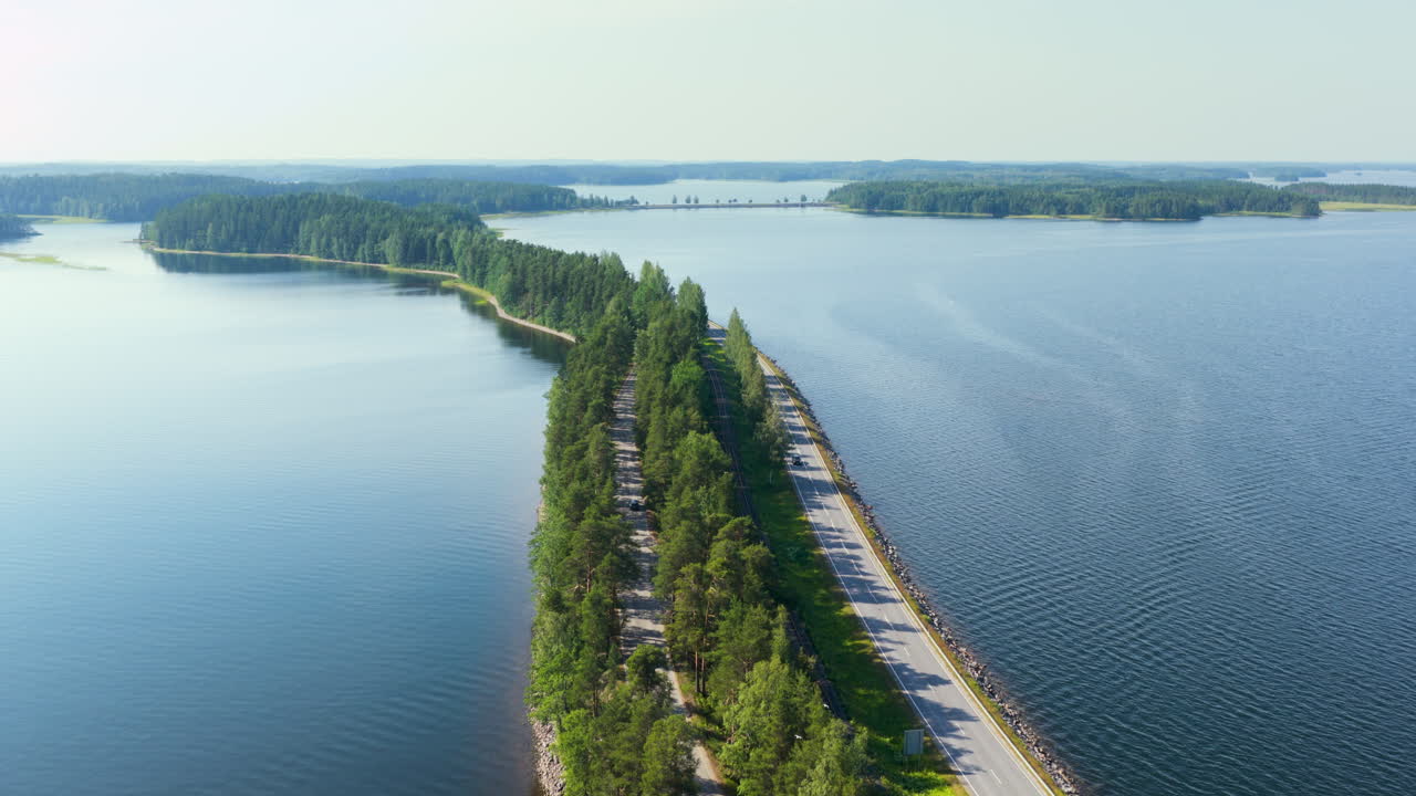 Aerial view following the Punkaharju scenic road, sunny, summer day in Finland