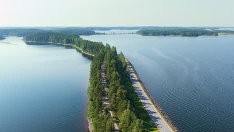 aerial view following the punkaharju scenic road, sunny, summer day in finland