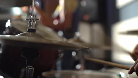 drummer and band at concert, close up view of drum plate