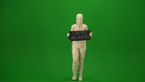 green screen isolated chroma key video capturing a mummy dancing and singing actively into the - green screen isolated chroma key video capturing a mummy dancing and singing actively into the microphone. haloween holidays. mock up, workspace for your promotion clip or advertisement