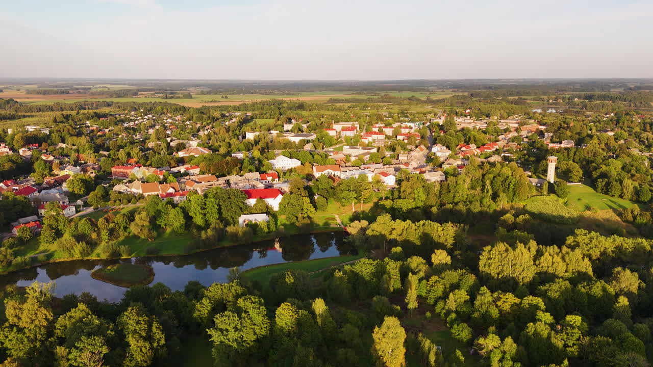 Aerial flying over picturesque town of Aizpute during summer, Latvia