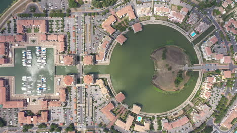 right-to-left-aerial-top-shot-Lattes-Port-Ariane-marina-lake-and-houses