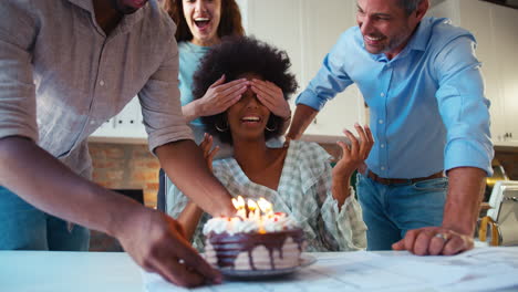 Staff-Celebrating-Birthday-Of-Female-Colleague-In-Architects-Office-With-Cake