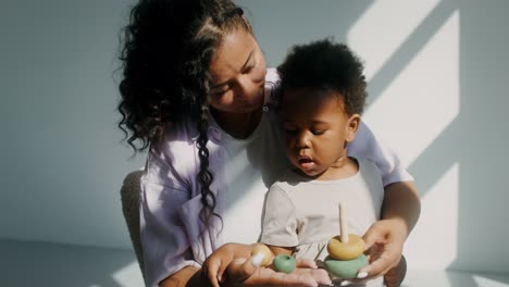mother and child playing with stacking rings