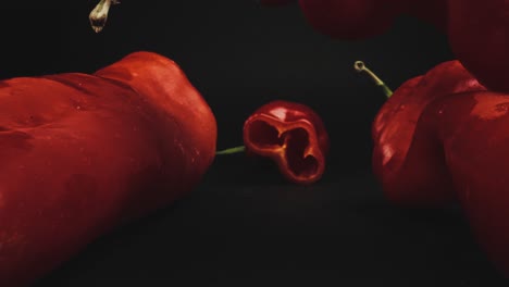 red horn peppers with one sliced open