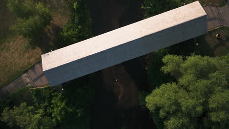 Overhead-View-Of-North-Fork-Zumbro-River-With-Covered-Bridge-In-Zumbrota,-Minnesota,-United-States