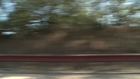 a car travels along a scenic highway near los angeles california as seen through the side window 2