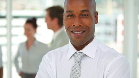 Business-man-smiling-as-the-camera-moves