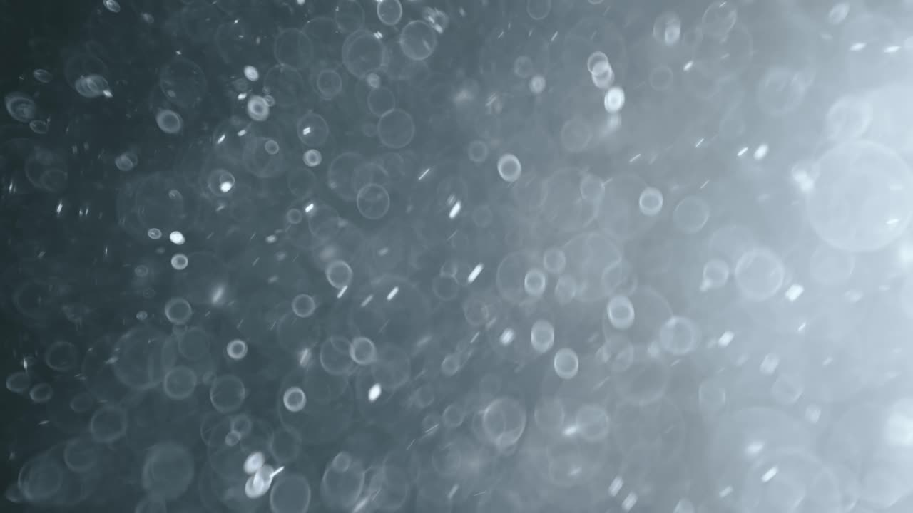 bokeh de partículas abstractas flotantes sobre fondo oscuro