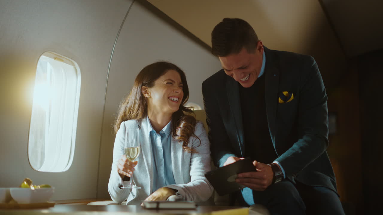 Business people traveling on private jet