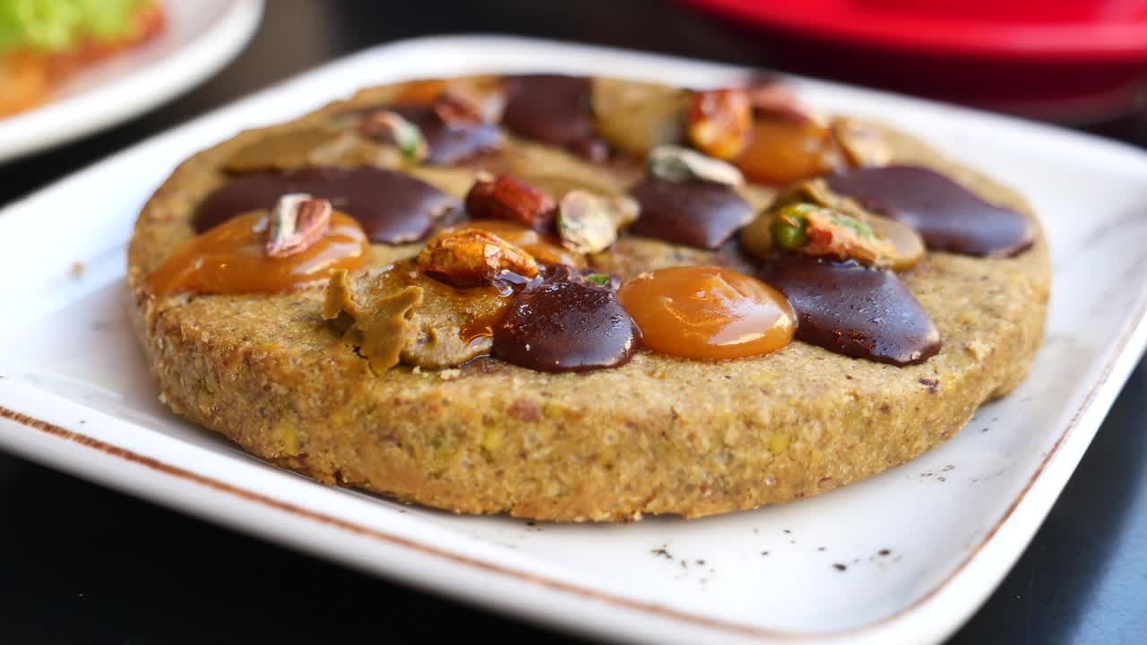 Gourmet Dessert with Chocolate, Caramel, and Mixed Nuts