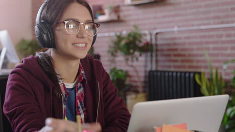 young caucasian woman intern using laptop computer video chat conversation discussing startup company enjoying conference call online communication in trendy office workplace