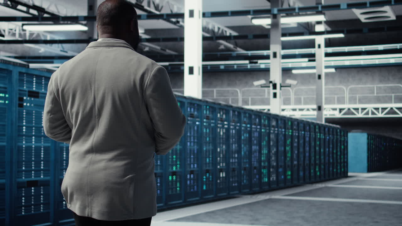 Vertical video Admin walking in data center, doing inspection on infrastructure tech