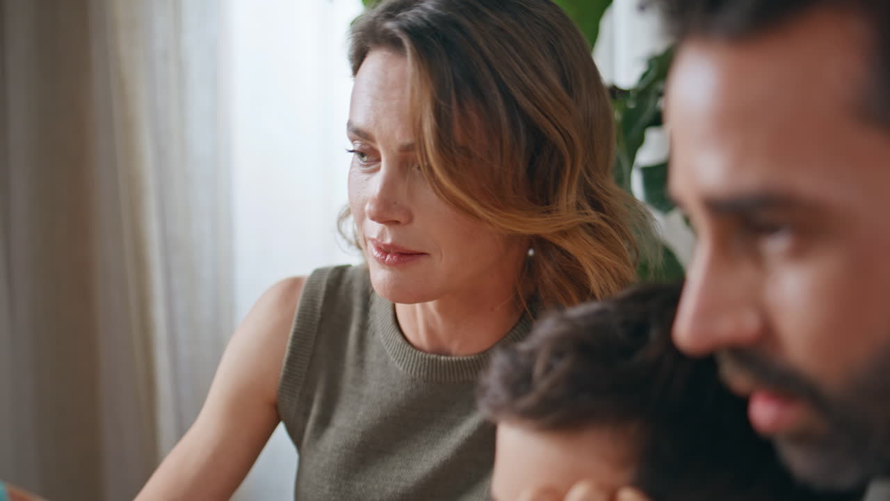 Closeup parents child talking laptop at apartment. Family studying remotely