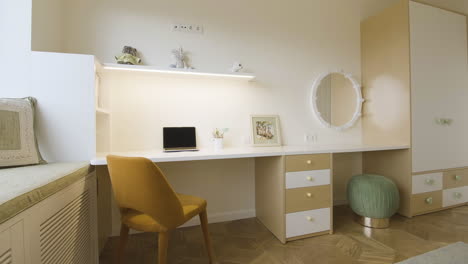child's room with desk and dressing table