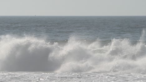 large crashing waves along monterey bay, california