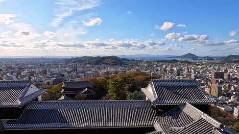 View-from-the-castle-towers-ont-the-yard-an-roofs-of-Matsuyama-Castle,-Shikoku,-Ehime,-Japan