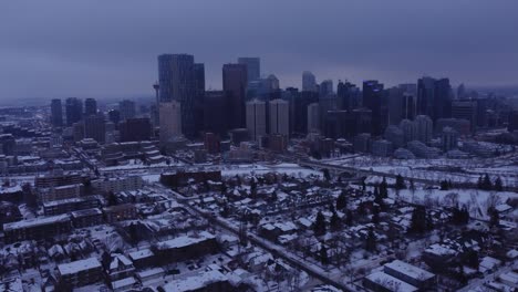 experience the enchantment of a winter cityscape shrouded in fog with this mesmerizing drone footage of a misty, moody downtown