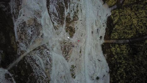 Aerial view of overlander vehicles camping on the side of the Dempster Highway in Northern Canada.