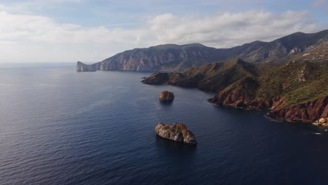 sensational sardinia coastline in nebida with pan di zucchero sea stack, aerial