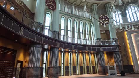interior of a mosque with columns and balcony
