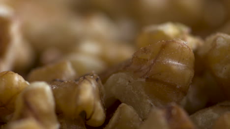 walnut pieces falling into a dish