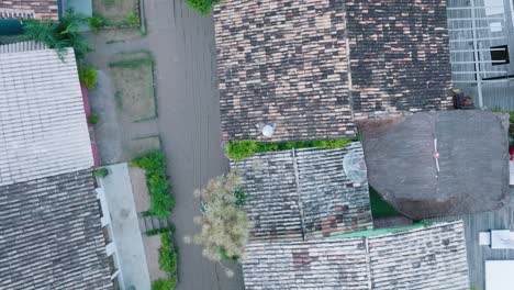 aerial top-down drone view of rural beach town caraiva bahia brazil flying over rooftops