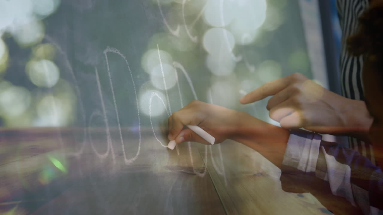 Schoolboy writing on a chalkboard