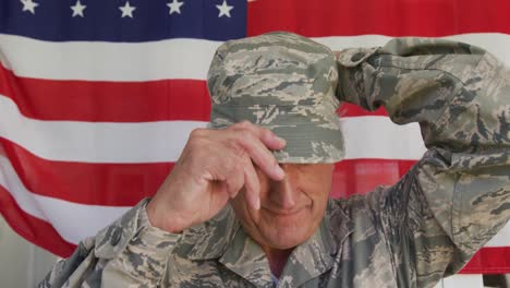 video of happy caucasian senior soldier wearing uniform standing outside house