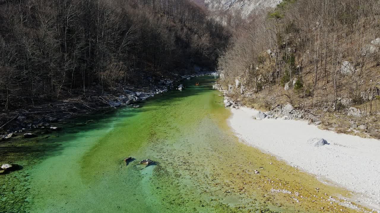 Pristine shoreline and crystal clear waters of the Soča River, Slovenia, Spring