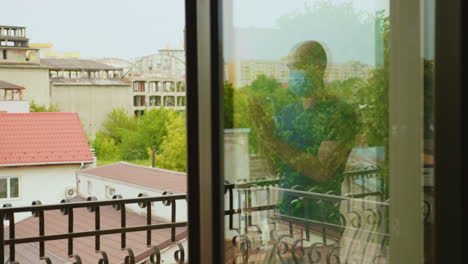 reflexion of man on balcony clapping