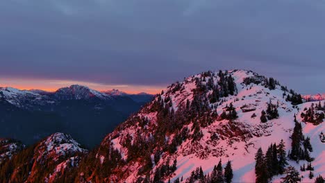 Snowy-Mountain-Peaks,-Dramatic,-Colorful-Sunset-Sky