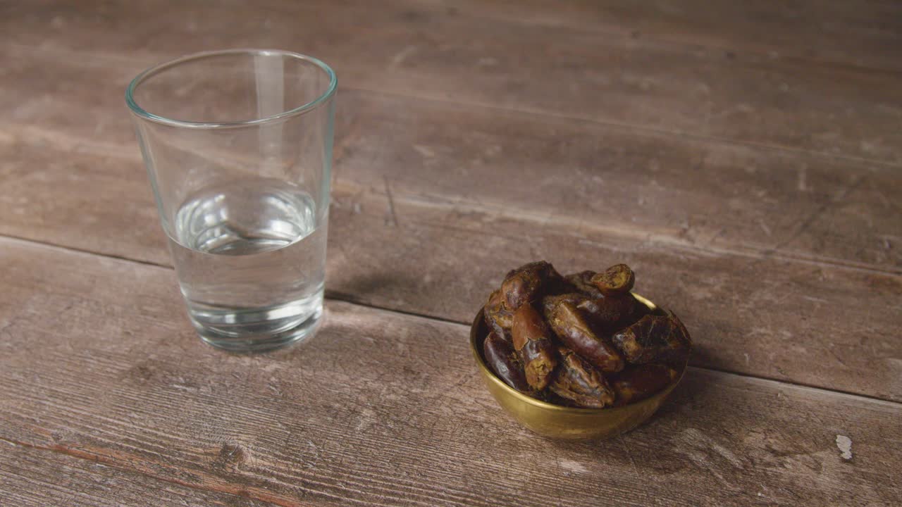 Handheld Shot of Dates and Water