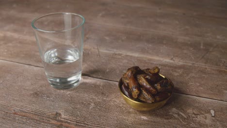 handheld shot of dates and water