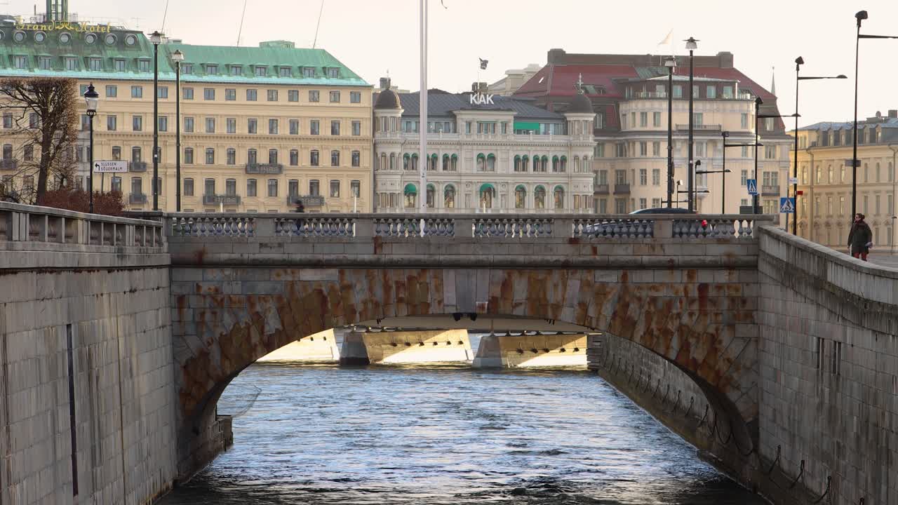 A Historic Stone Arch Bridge Spanning a Waterway in a European City