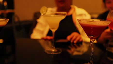 friends enjoying cocktails at a bangkok bar