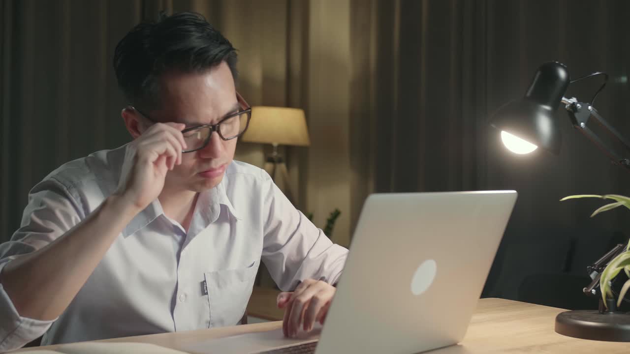 Tired Man Working Late at Night