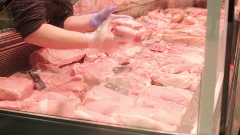 a meat shop specializing in fresh products. the scene shows neatly arranged meat on display counters, showcasing high-quality cuts in a clean and professional retail environment