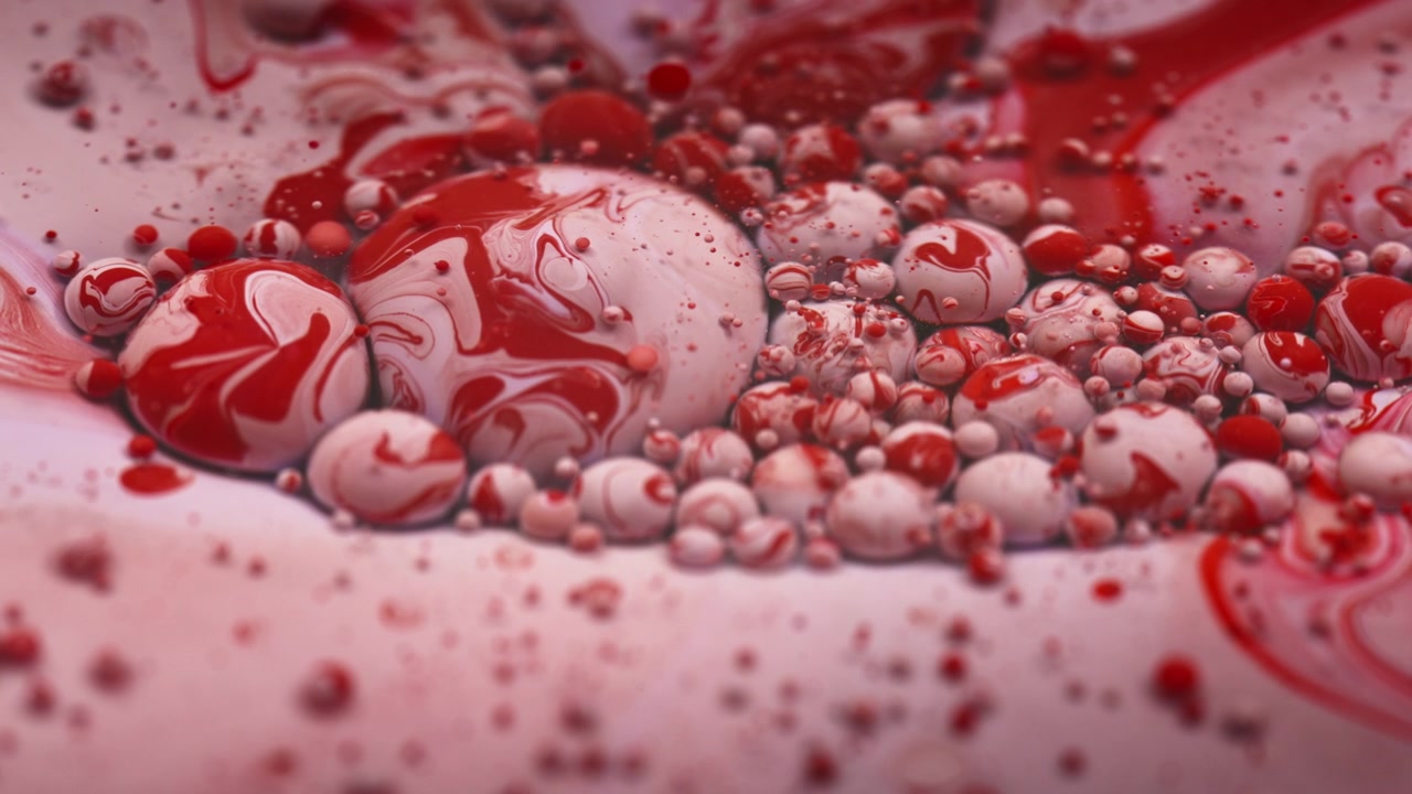 Red and pink colored paint bubbles