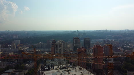 panning aerial view of kyiv cityscape high above the construction site near olympiyskiy. ukraine drone b roll