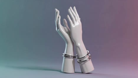 white mannequin hands with silver cuffs