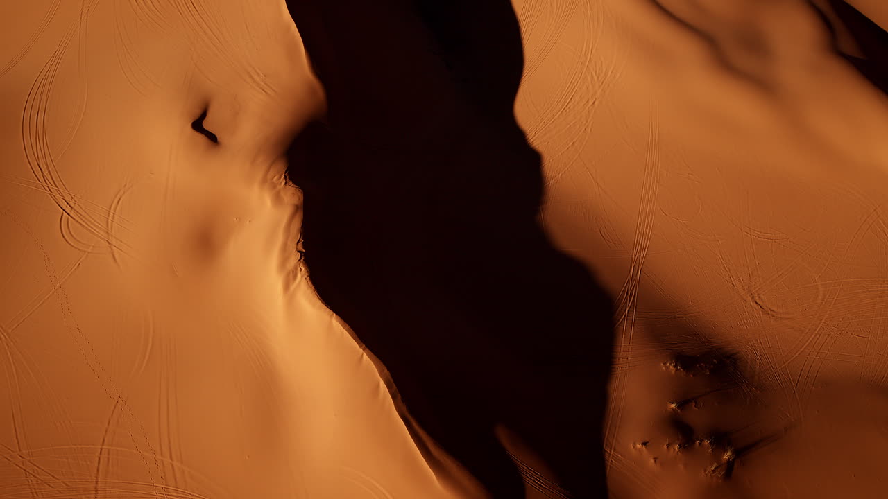 Looking straight down, the drone captures an artistic mix of pink sands and wild shapes in southern Utah.
