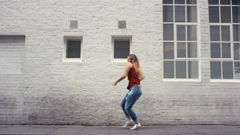 dance loop funny woman dancing in street having fun girl celebrating with funky looping dance