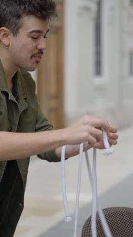 man performing a rope trick outdoors