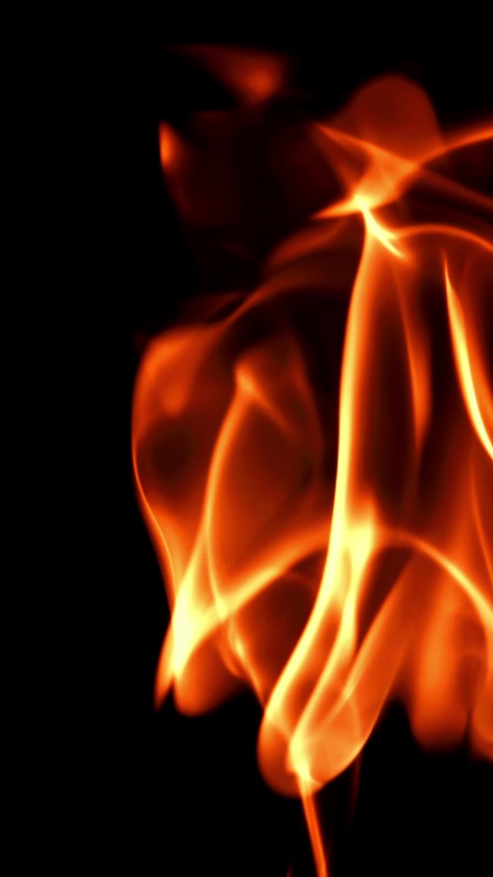 Abstract Orange and Yellow Flames Dancing on Black Background