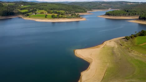 aerial view of portodemouros reservoir on a sunny day in la coruña, spain